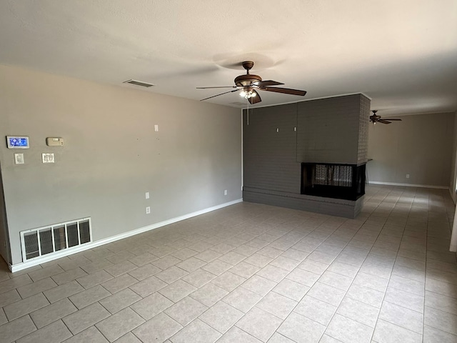 unfurnished living room with a ceiling fan, baseboards, a fireplace, and light tile patterned floors