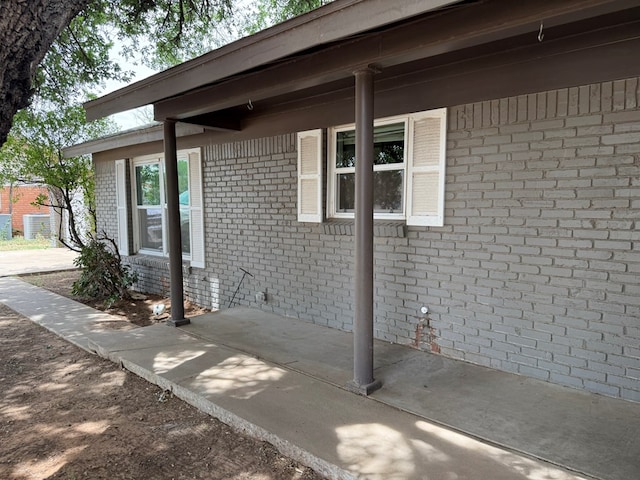view of side of home featuring brick siding