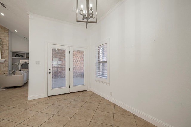 doorway with ornamental molding, baseboards, and light tile patterned floors