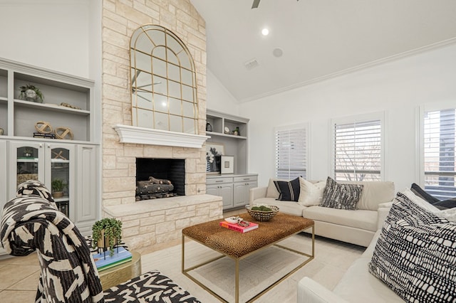 living room with high vaulted ceiling, a fireplace, light tile patterned flooring, and built in features