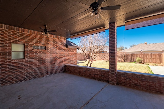 view of patio with a fenced backyard and ceiling fan