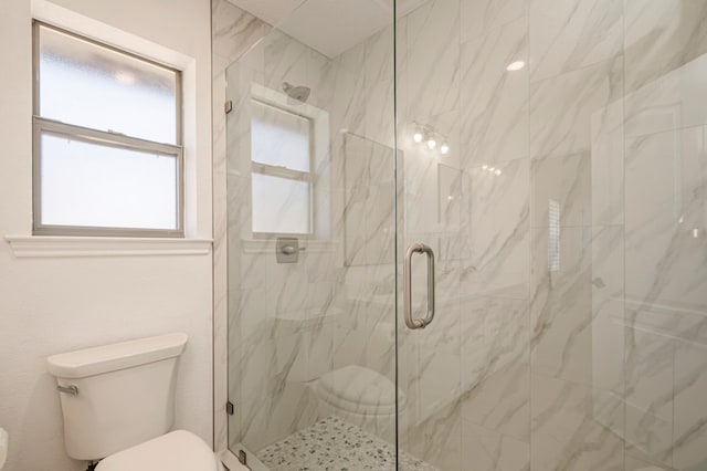 full bathroom featuring a marble finish shower and toilet