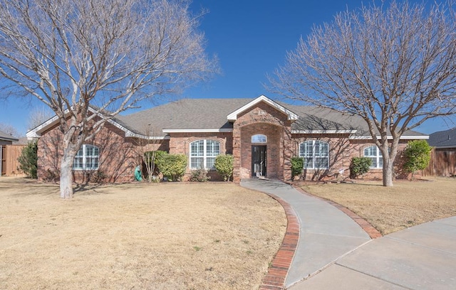 ranch-style house with a front yard