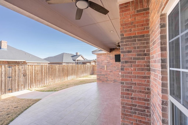 view of patio featuring ceiling fan