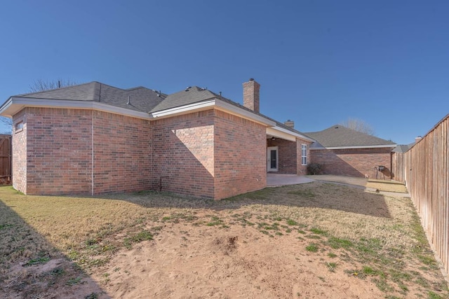 rear view of property featuring a patio