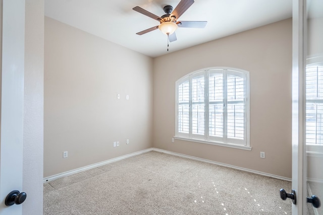 carpeted empty room with ceiling fan