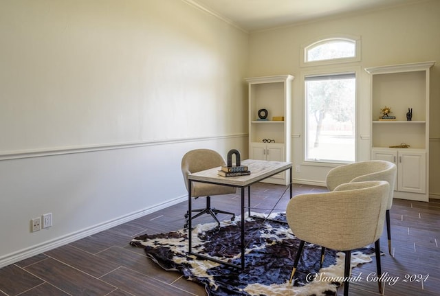 home office with crown molding, built in features, and dark wood-type flooring