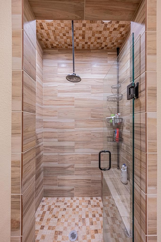 bathroom with a shower stall