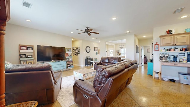 living area with visible vents, a ceiling fan, recessed lighting, and light speckled floor