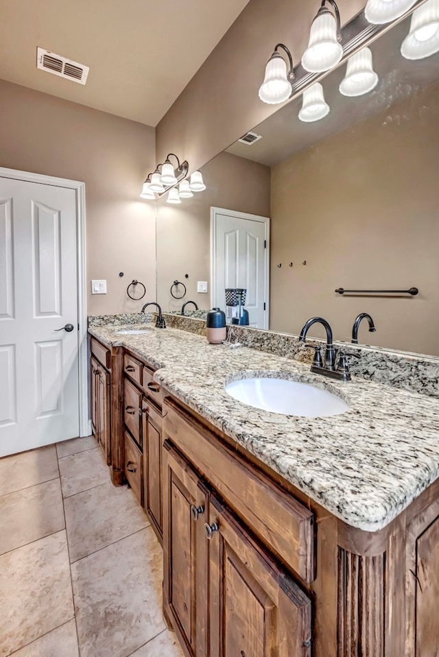 bathroom with vanity and tile patterned floors