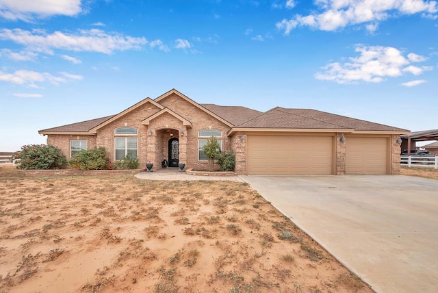 ranch-style house featuring a garage