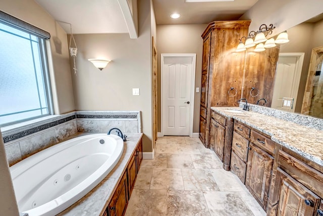 bathroom with vanity and a tub