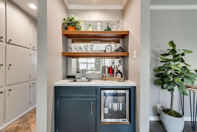 bar with wine cooler, indoor wet bar, a sink, and crown molding