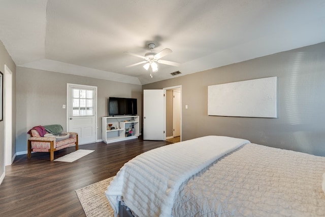 bedroom featuring ceiling fan, lofted ceiling, visible vents, baseboards, and dark wood-style floors