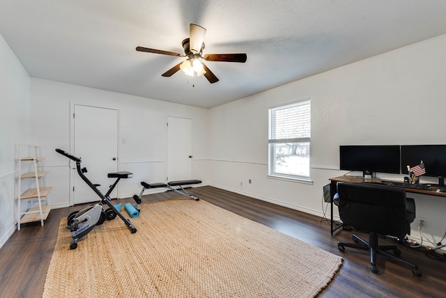 office space featuring a ceiling fan, dark wood finished floors, and baseboards