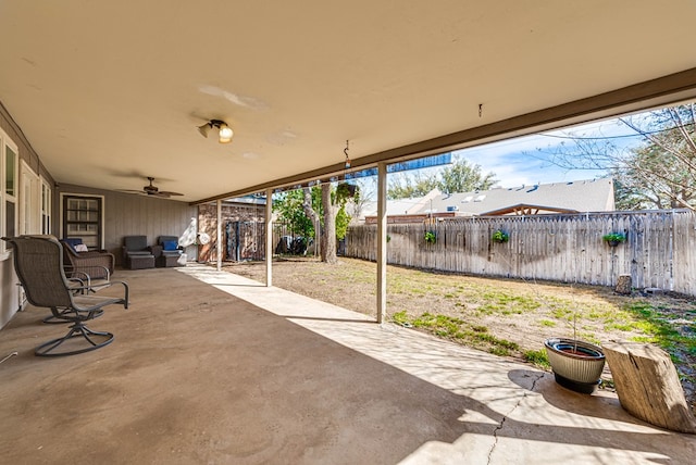 view of patio / terrace with a fenced backyard and ceiling fan