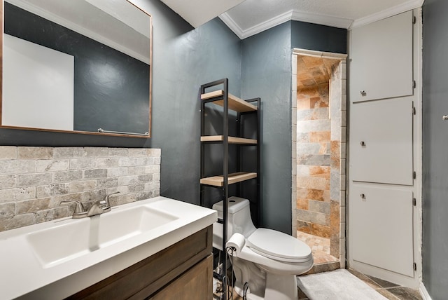 bathroom with decorative backsplash, toilet, crown molding, vanity, and a shower stall