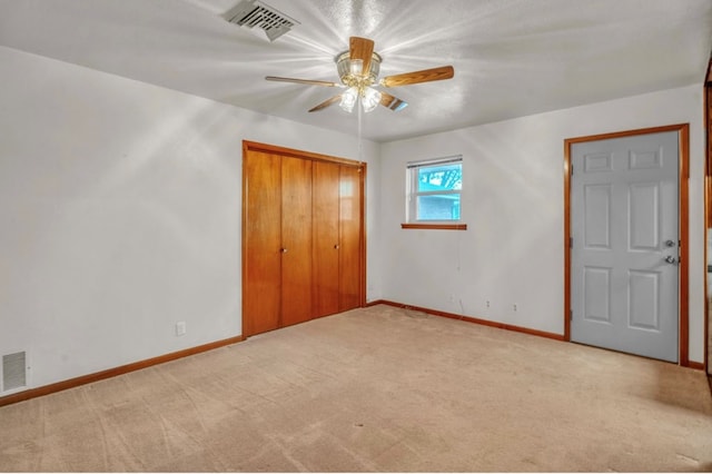 312 N Main St, Coahoma, TX 79511 - unfurnished bedroom featuring baseboards, a closet, visible vents, and carpet