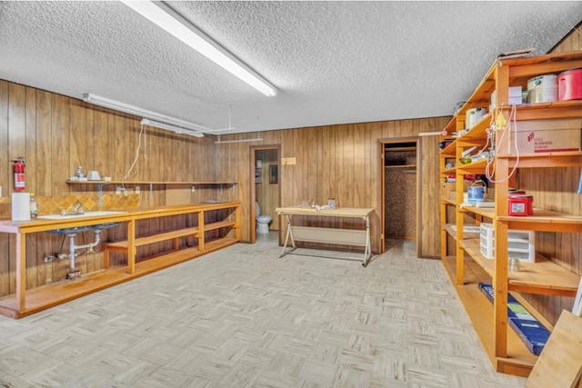 312 N Main St, Coahoma, TX 79511 - interior space with wooden walls and a textured ceiling