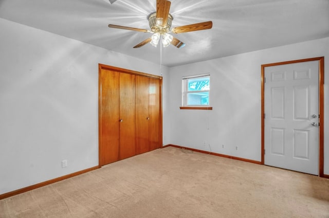 312 N Main St, Coahoma, TX 79511 - unfurnished bedroom featuring baseboards, a ceiling fan, carpet flooring, and a closet