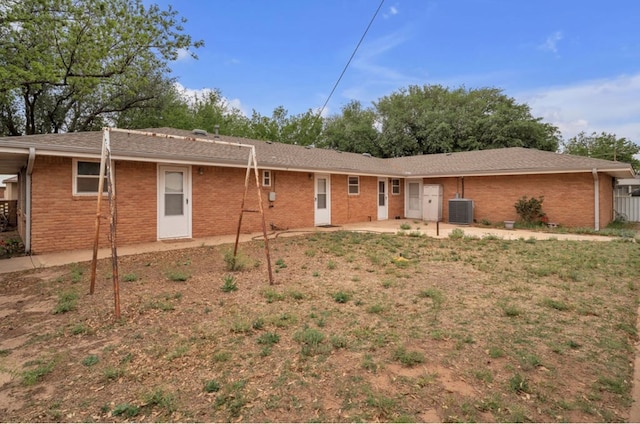 312 N Main St, Coahoma, TX 79511 - rear view of house with brick siding, central air condition unit, and a patio area