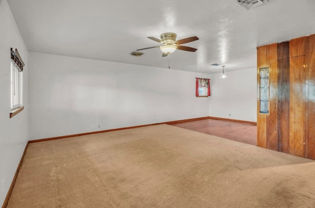 312 N Main St, Coahoma, TX 79511 - unfurnished room with ceiling fan, baseboards, carpet flooring, and visible vents