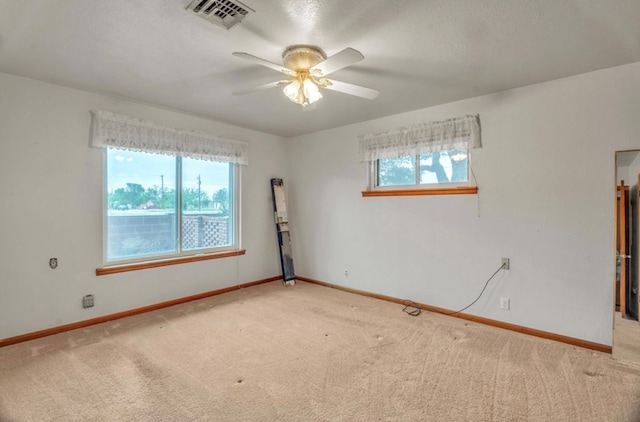 312 N Main St, Coahoma, TX 79511 - carpeted empty room with ceiling fan, baseboards, and visible vents