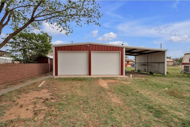 312 N Main St, Coahoma, TX 79511 - garage with fence, driveway, and a detached garage