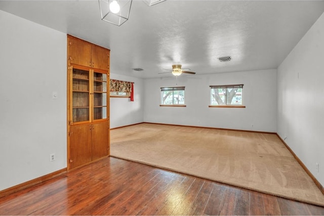 312 N Main St, Coahoma, TX 79511 - unfurnished room with baseboards, wood finished floors, and visible vents