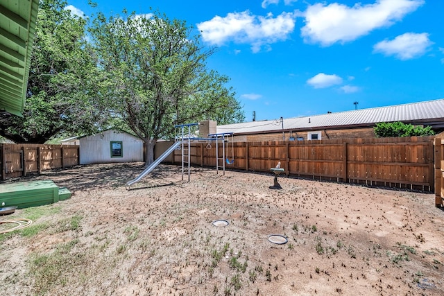 view of yard with a playground