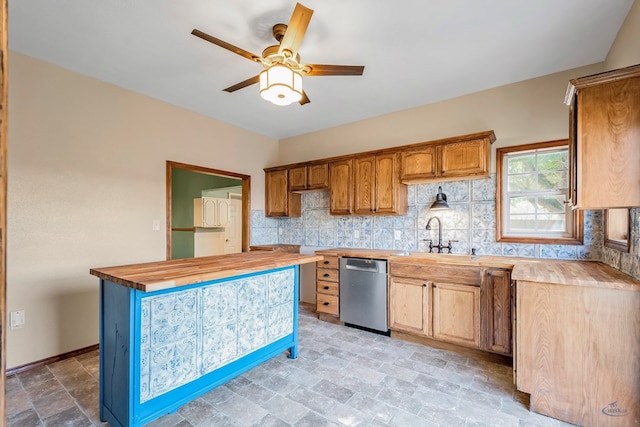 kitchen featuring decorative backsplash, ceiling fan, sink, dishwasher, and butcher block counters