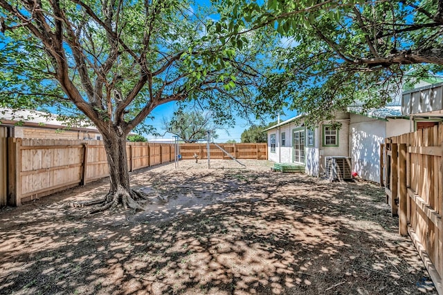 view of yard with central AC