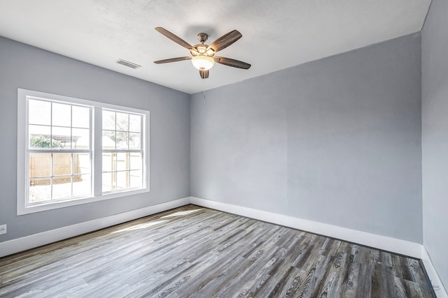 spare room featuring ceiling fan and hardwood / wood-style floors