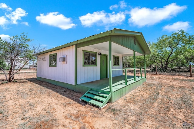 view of property exterior featuring covered porch