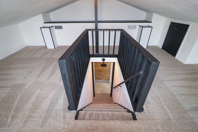 stairs with carpet and vaulted ceiling