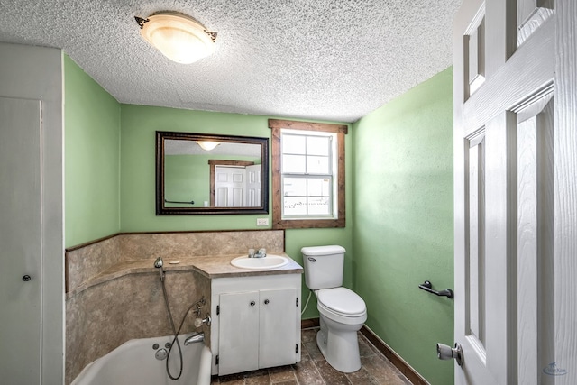 bathroom with vanity, toilet, and a bath