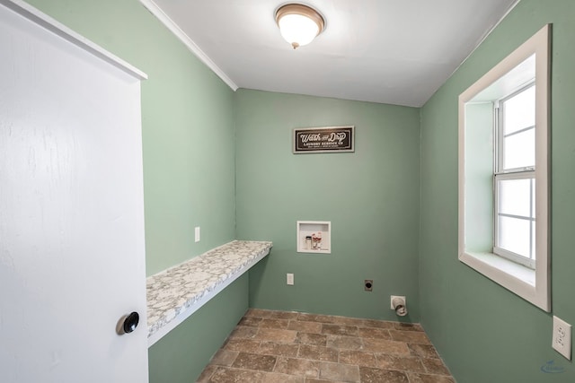 clothes washing area featuring hookup for an electric dryer, hookup for a washing machine, and crown molding