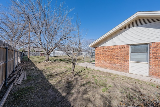 view of yard with a fenced backyard