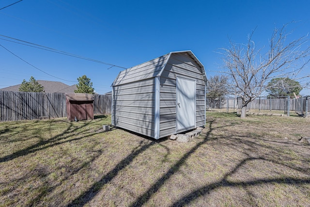 view of shed with a fenced backyard