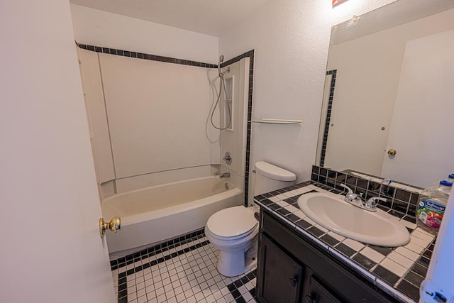 bathroom featuring tasteful backsplash, toilet, vanity, shower / tub combination, and tile patterned floors