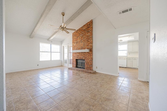 unfurnished living room featuring light tile patterned floors, beam ceiling, a fireplace, and visible vents