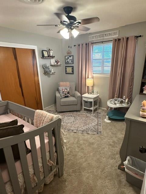 carpeted bedroom with ceiling fan