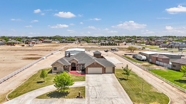 birds eye view of property with a residential view