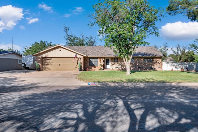1412 Sparks St, Midland, TX 79701 - ranch-style house featuring an attached garage and concrete driveway
