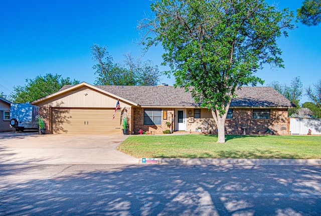 1412 Sparks St, Midland, TX 79701 - ranch-style home with concrete driveway, a garage, brick siding, and a front yard