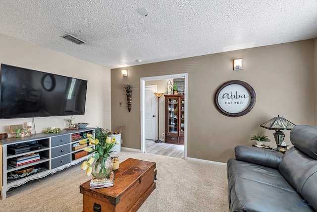 1412 Sparks St, Midland, TX 79701 - living room with light carpet, a textured ceiling, and baseboards