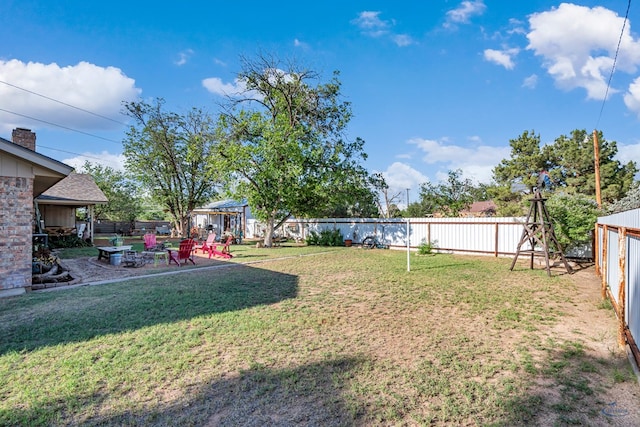 1412 Sparks St, Midland, TX 79701 - view of yard featuring a patio and a fire pit