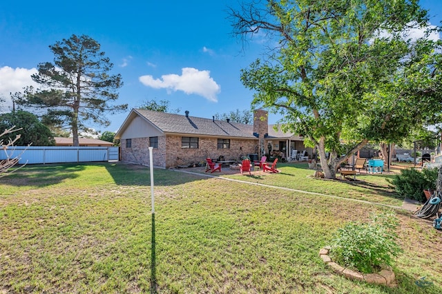 1412 Sparks St, Midland, TX 79701 - rear view of house featuring brick siding, a chimney, and a patio