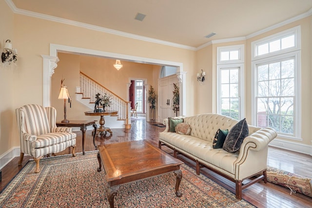 living room featuring wood-type flooring and ornamental molding