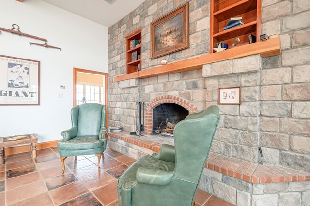 living room with a fireplace and built in features